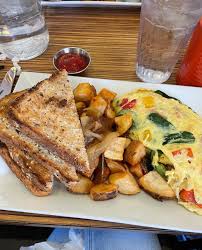 Sabrina's Cafe signature dishes Bella Vista Omelet
Egg Sandwich
Shrimp and Grits